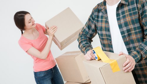 Removal team preparing a move in Gunnersbury with boxes and furniture