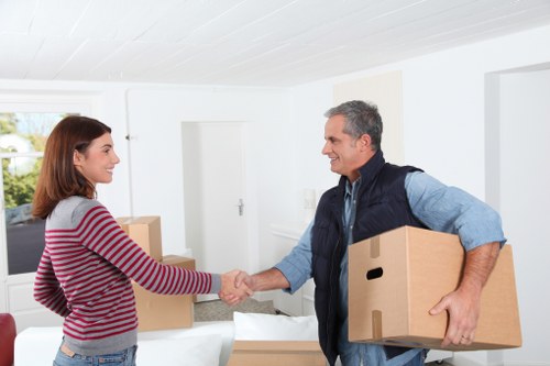 Careful lifting of household items by trained movers