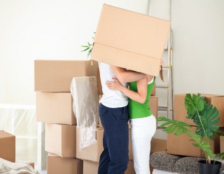 Office movers handling desks and equipment in West London