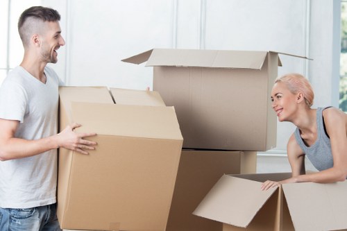 Furniture and boxes being loaded into a van for transport