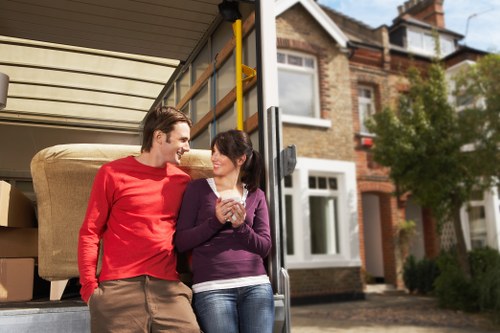 Packed moving boxes and furniture ready for local house removals